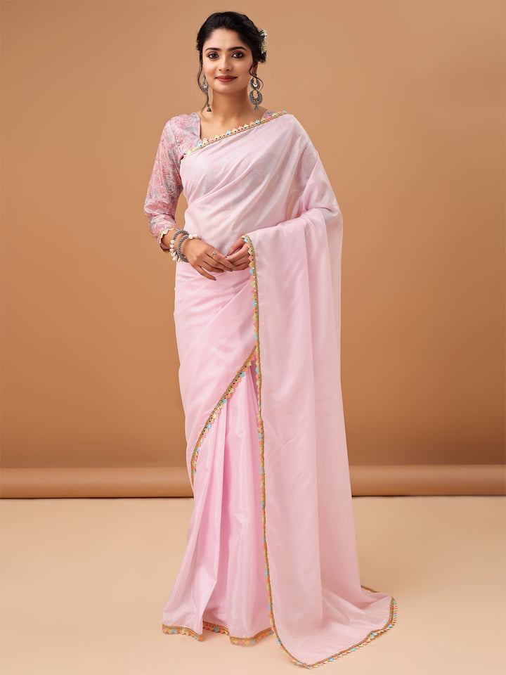 Elegant Pastel Pink Saree with Printed Blouse and Embroidered Clutch