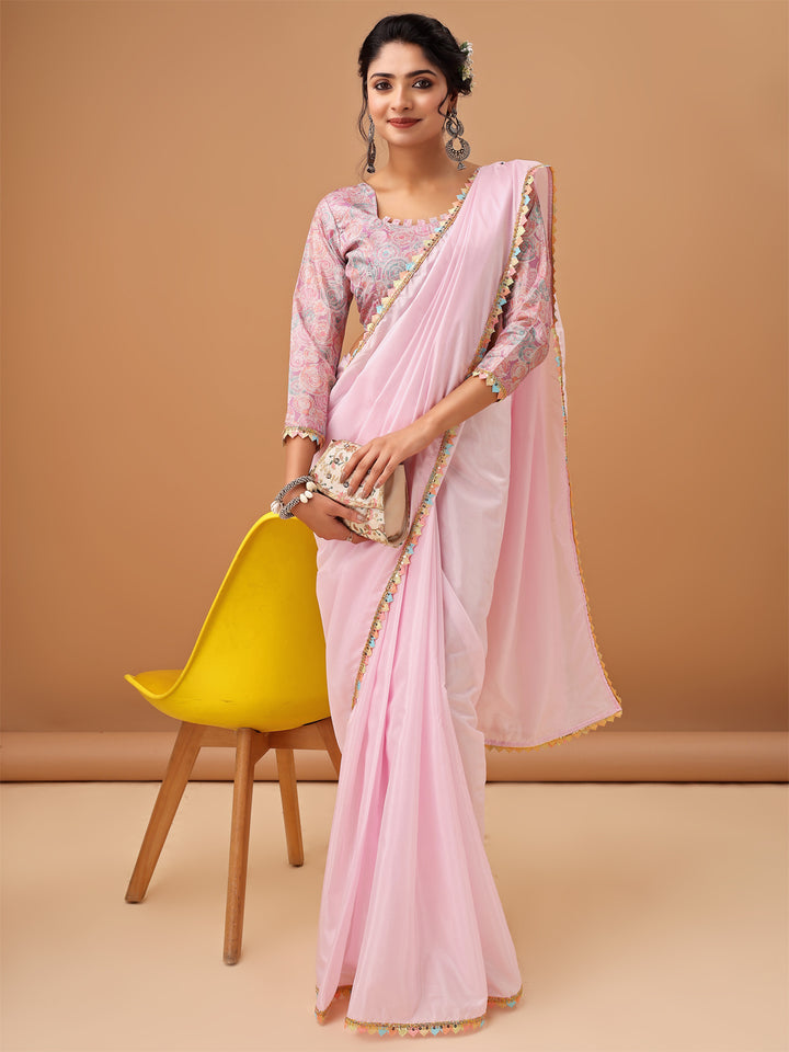 Elegant Pastel Pink Saree with Printed Blouse and Embroidered Clutch