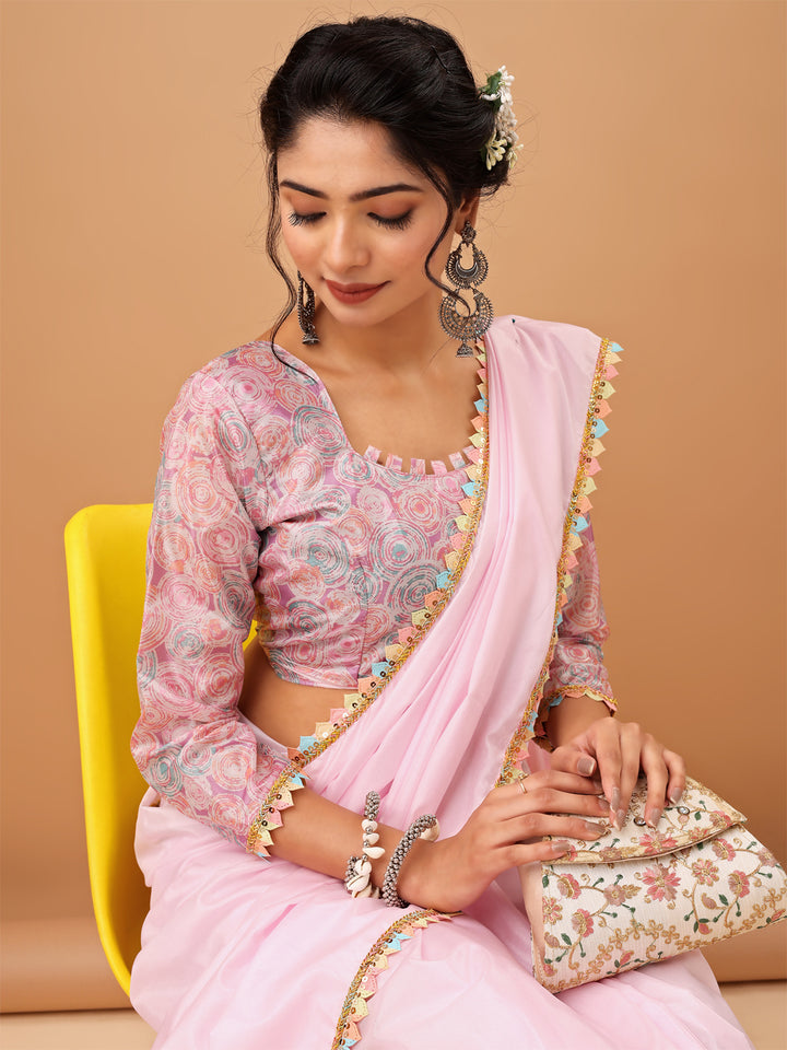 Elegant Pastel Pink Saree with Printed Blouse and Embroidered Clutch