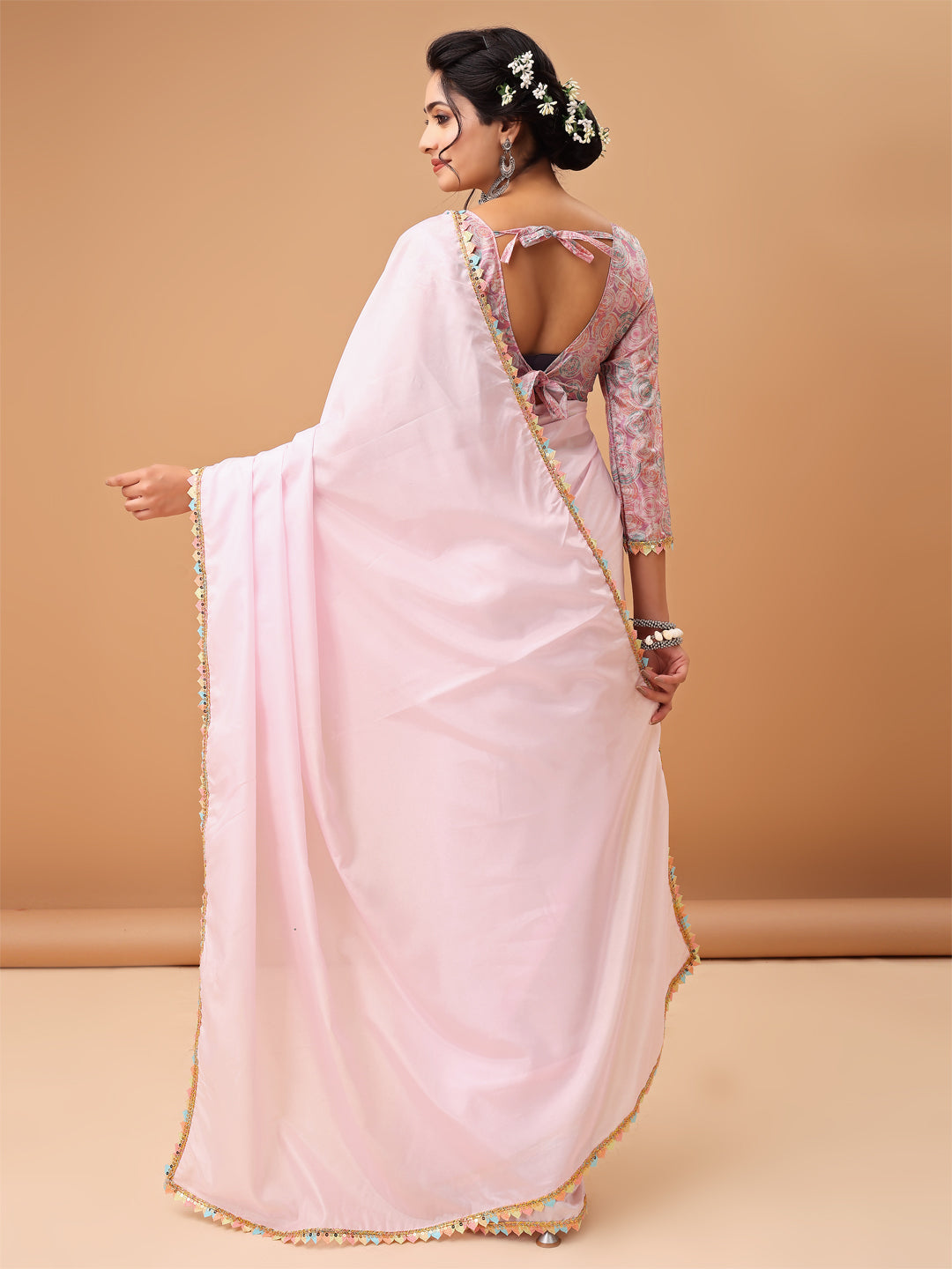 Elegant Pastel Pink Saree with Printed Blouse and Embroidered Clutch